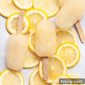 Easy lemonade popsicles recipe made with 3 ingredients and naturally sweetened with honey.