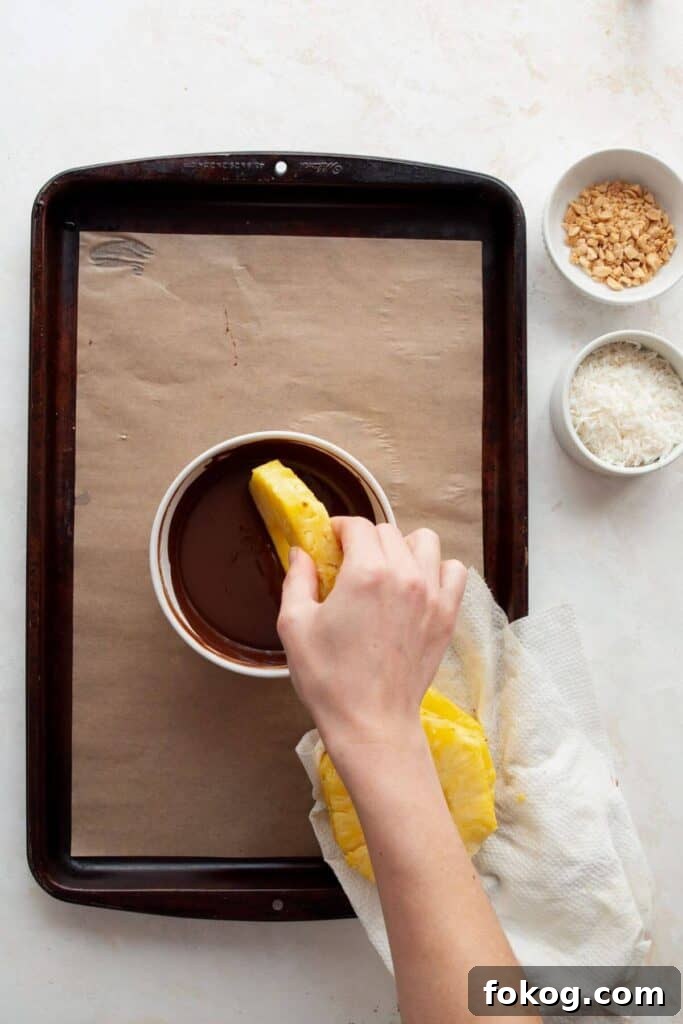 Chocolate-Covered Pineapple Recipe: Sweet Tropical Treat in Minutes 6 dipped freshly cut pineapple rings in melted chocolate