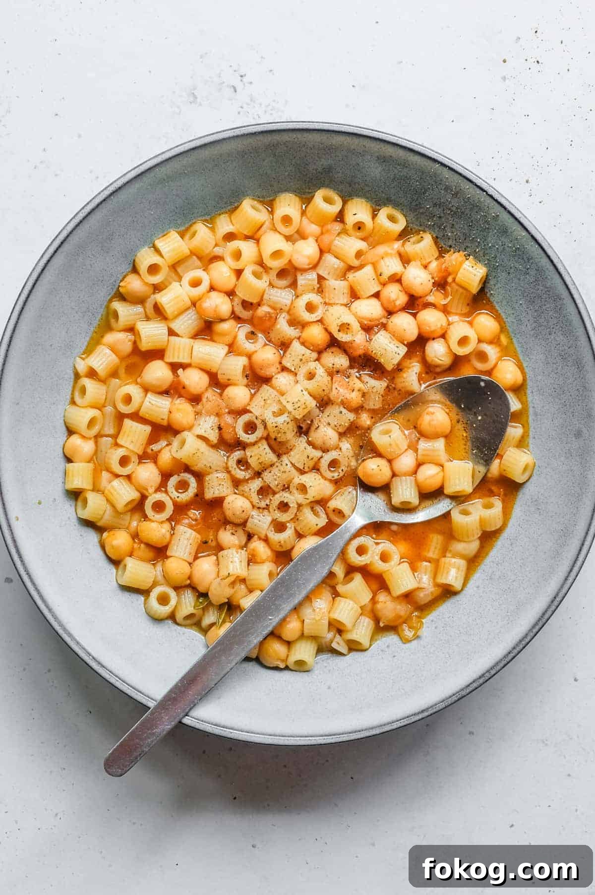 Pasta e Ceci – Italian Pasta with Chickpeas | cookeatworld.com an overhead photograph of a bowl of Italian pasta e ceci (pasta with chickpeas)