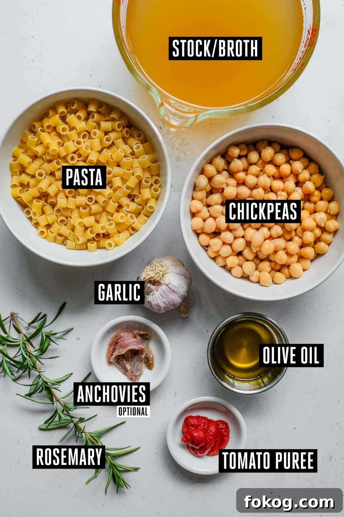 Pasta e Ceci – Italian Pasta with Chickpeas | cookeatworld.com the ingredients for pasta e ceci - stock, chickpeas, ditalini pasta, anchovies (optional), garlic, rosemary, oil, tomato paste.