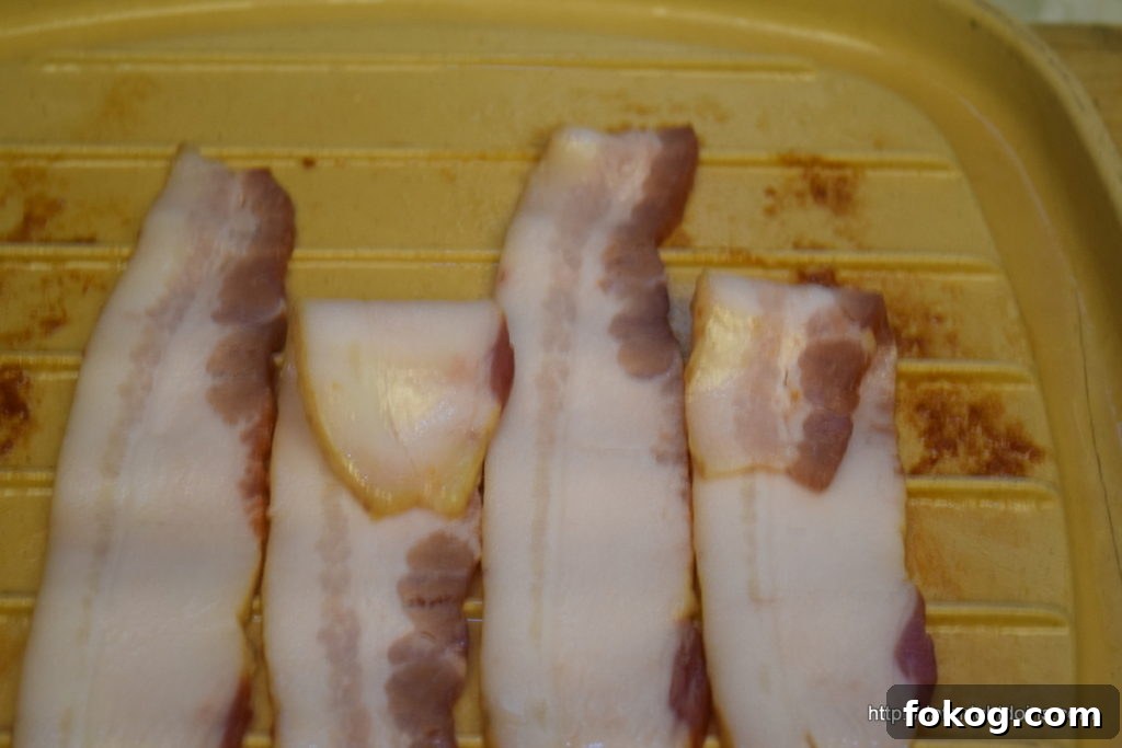 Crispy Bacon Squares: The Ultimate Burger Topping 5 Fold every other slice back and add new strip