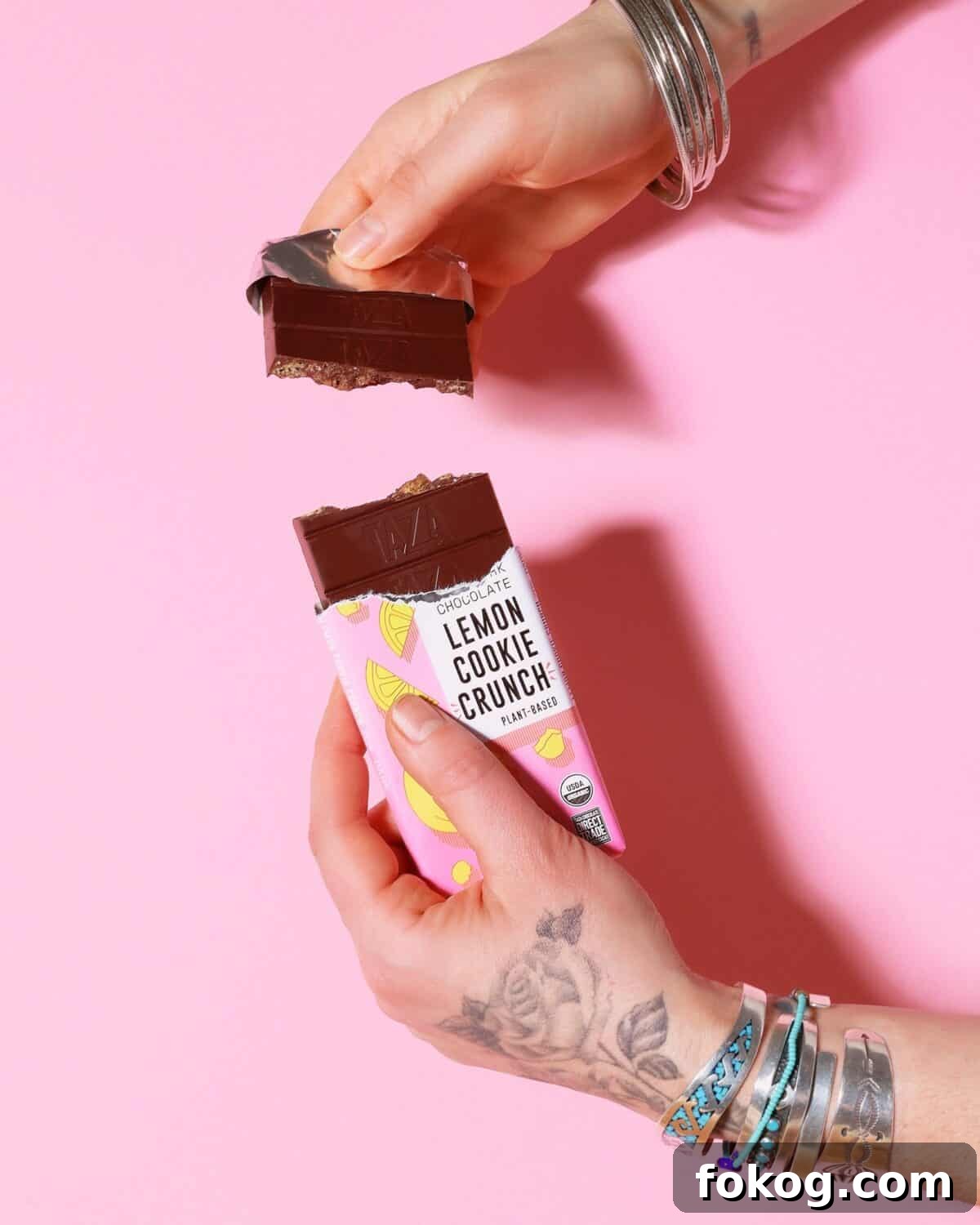 6 Organic Chocolate Brands Low in Heavy Metals 5 a picture of a hand breaking the chocolate from Taza
