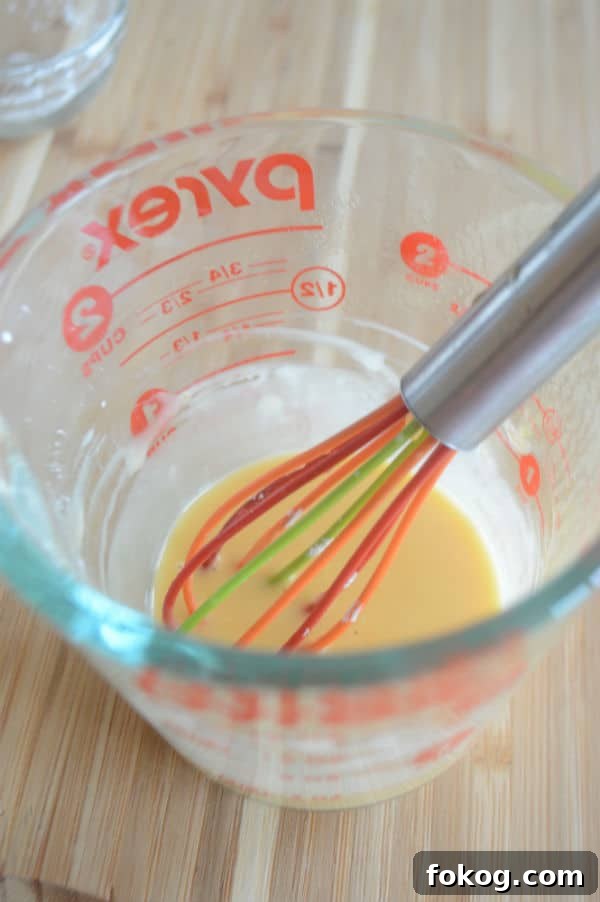 Qamar al-Deen Apricot Pudding Recipe: Traditional Middle Eastern Dessert 6 A glass mixture cup with pudding inside