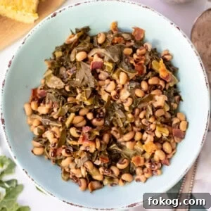 Instant Pot Black-Eyed Peas with Collard Greens and Ham 2 Instant Pot Black Eyed Peas with Greens in a blue serving dish.
