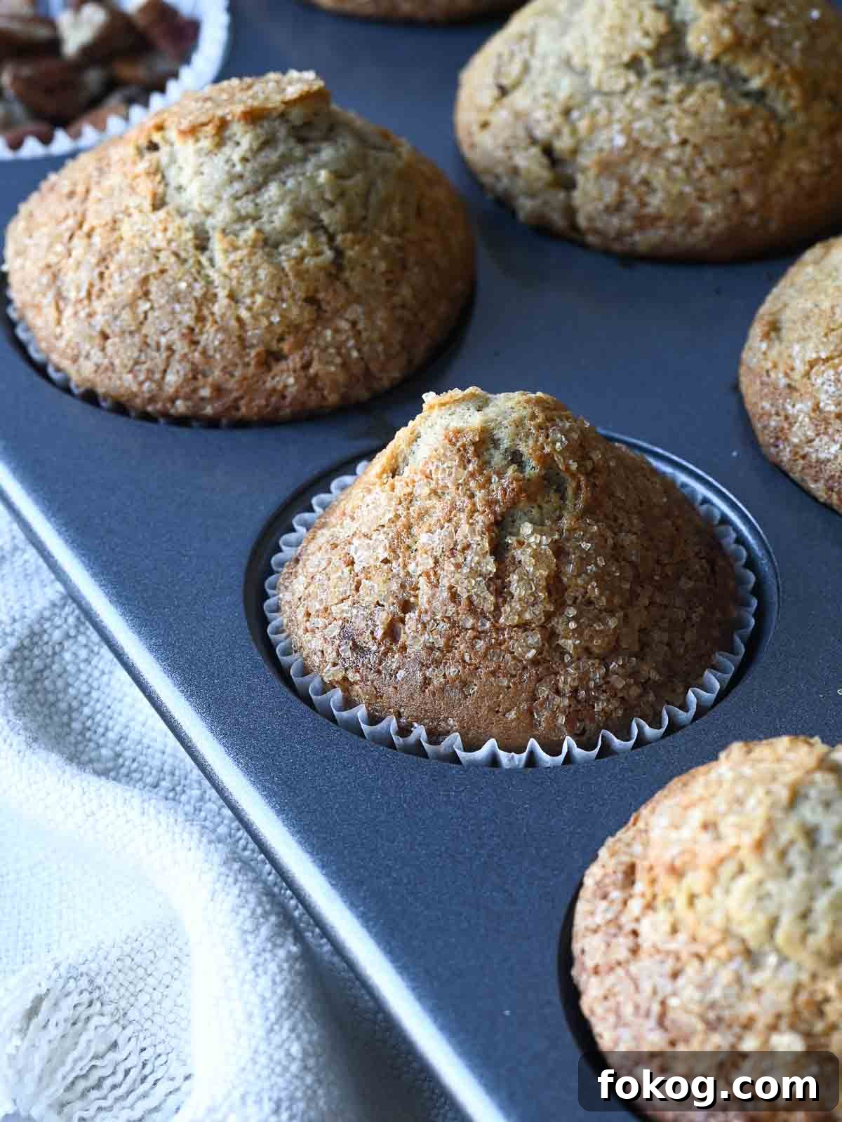 Moist Banana Pecan Muffins Recipe for Breakfast or Brunch 2 Just baked banana pecan muffins in a muffin tin.