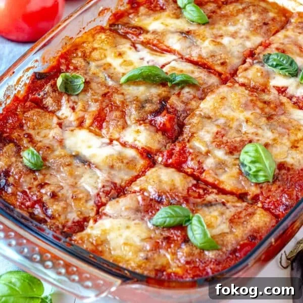 Parmigiana with eggplant and fresh basil leaves