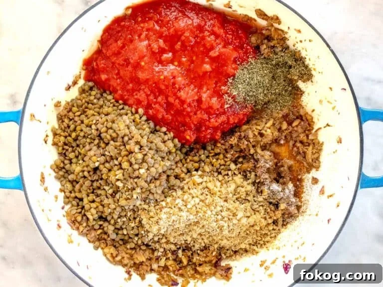 all the ingredients for the filling are in a skillet about to be cooked
