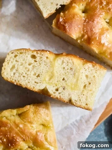 An overhead view of a slice of Sourdough Discard Focaccia.