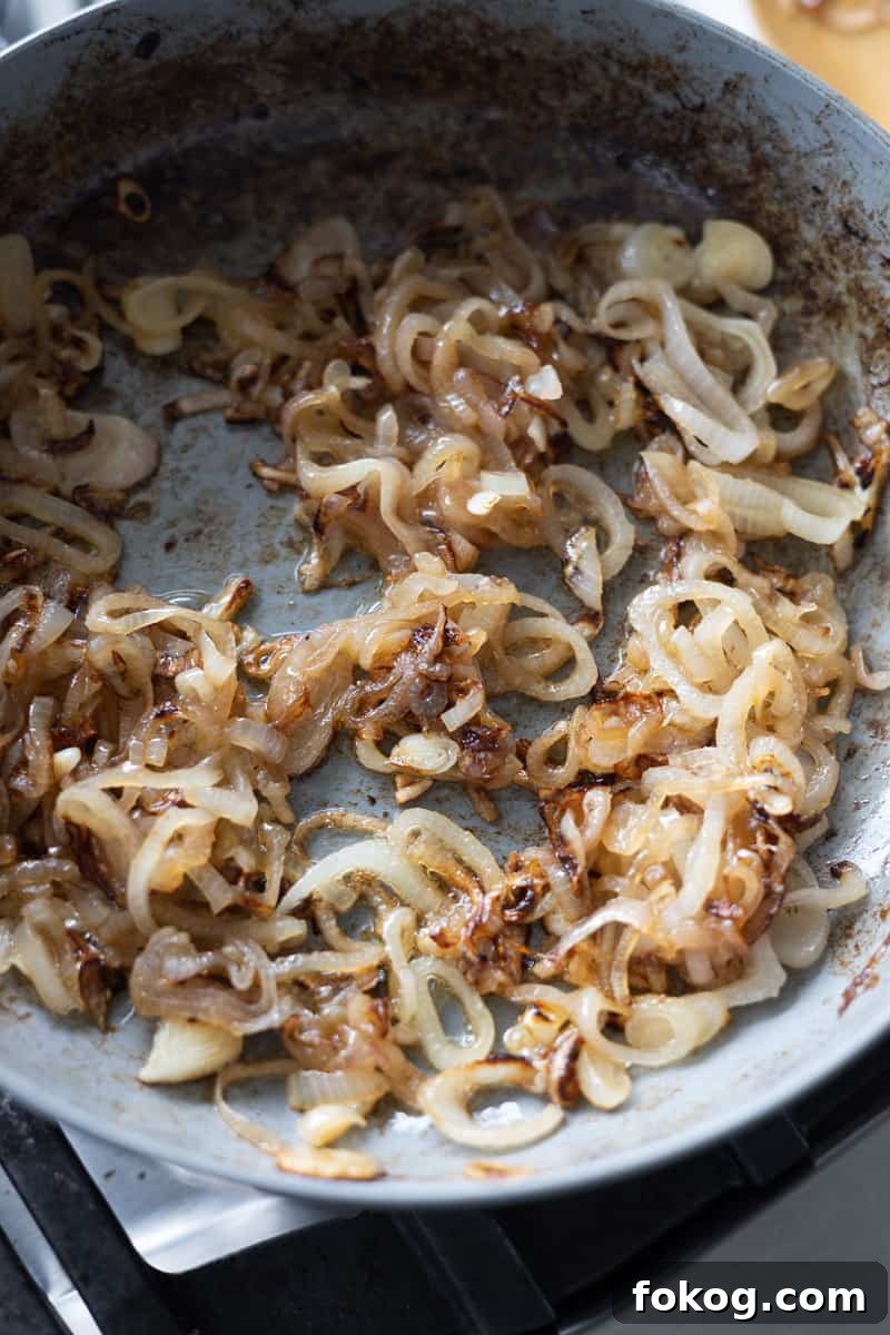 Caramelized shallots in a small skillet. 