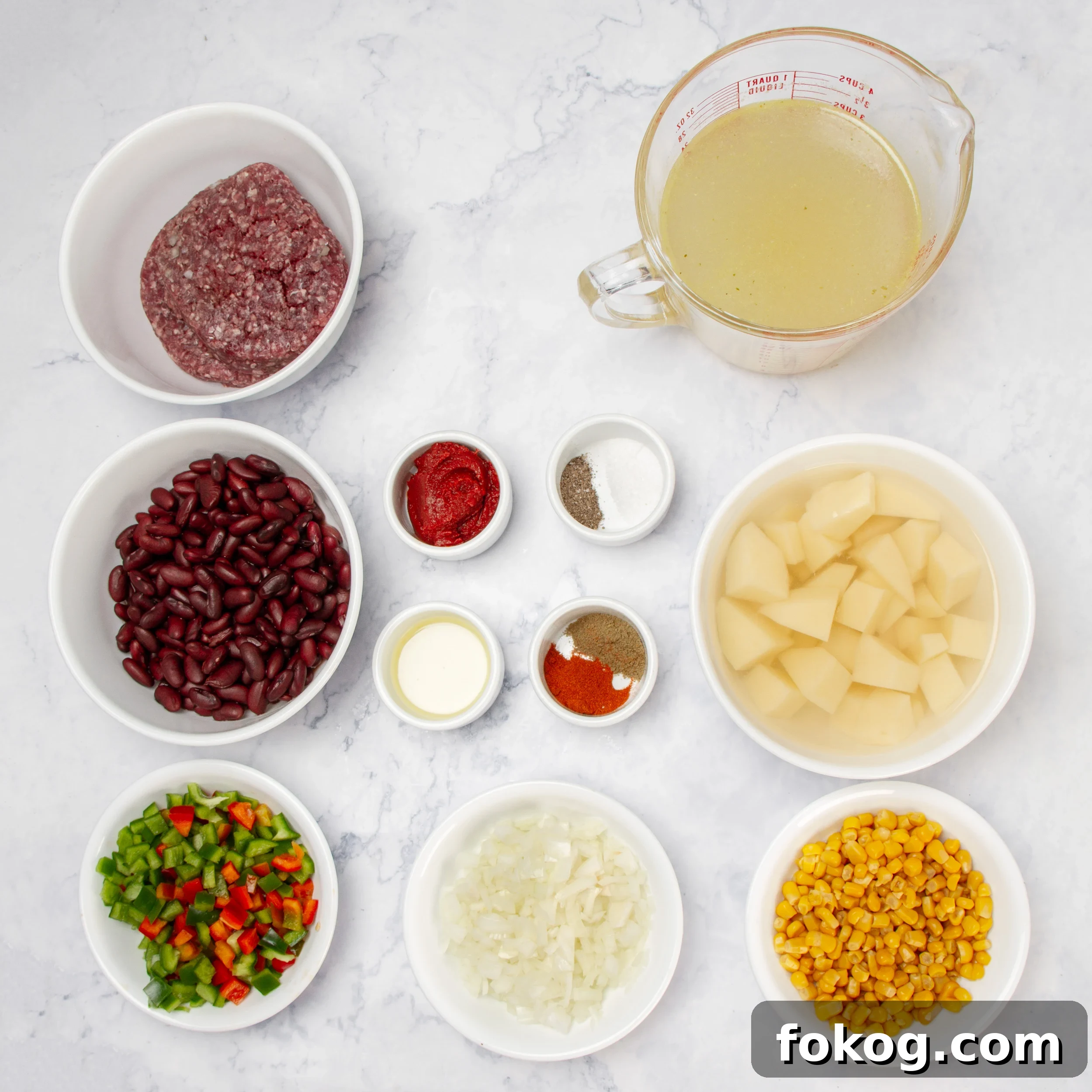 Cowboy Soup: Hearty Comfort Soup Recipe for Cozy Nights 3 Cowboy Soup ingredients in separate dishes on a counter.