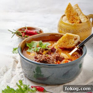 Cowboy Soup: Hearty Comfort Soup Recipe for Cozy Nights 8 Hearty and historic Cowboy Soup in a bowl with fresh toppings.