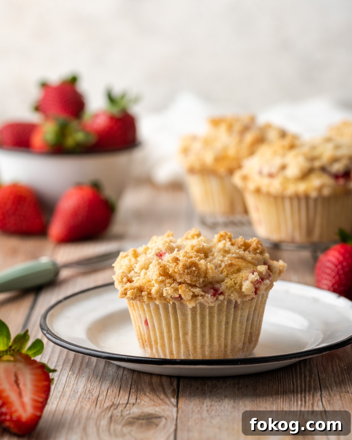 Gluten-Free Strawberry Muffins Recipe with Moist, Tender Crumbs 12 Strawberry muffin on a white plate.