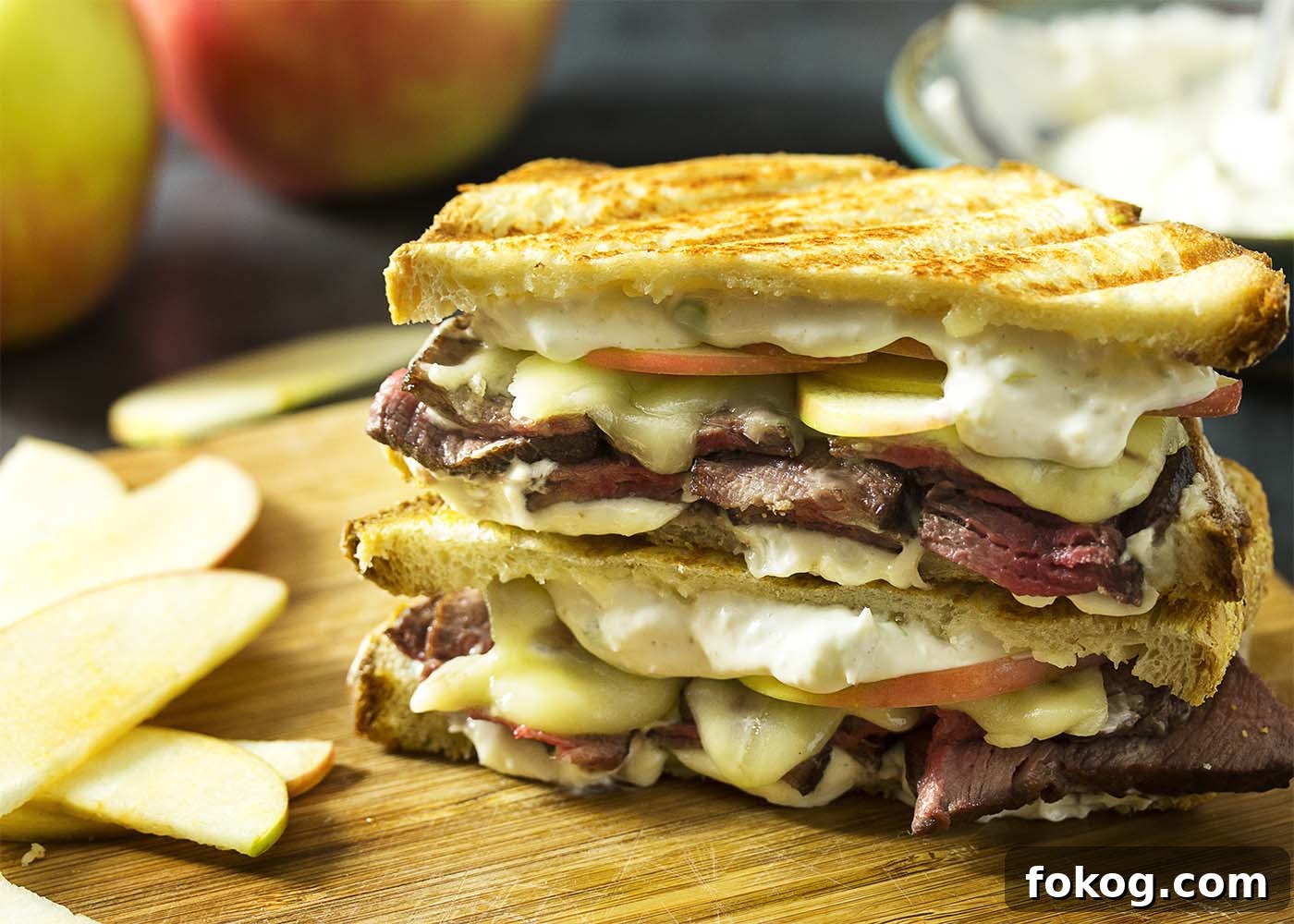 Roast beef panini close-up with apples and cheddar