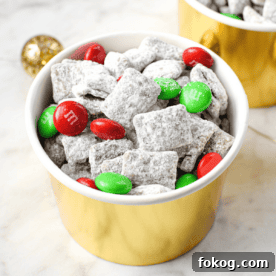 A white countertop with a gold cup full of cannabis puppy chow mix