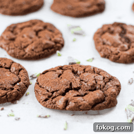 A picture of a chocolate mint cannabis cookie with a bite taken out.