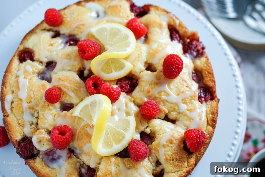 Raspberry Crumble Coffee Cake with Brown Sugar Streusel 2 Raspberry Coffee Cake sitting on a cake plate.