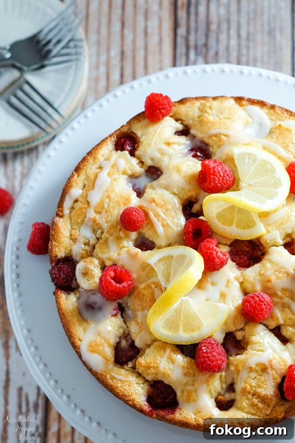 Raspberry Crumble Coffee Cake with Brown Sugar Streusel 6 Cake sitting on a cake plate.