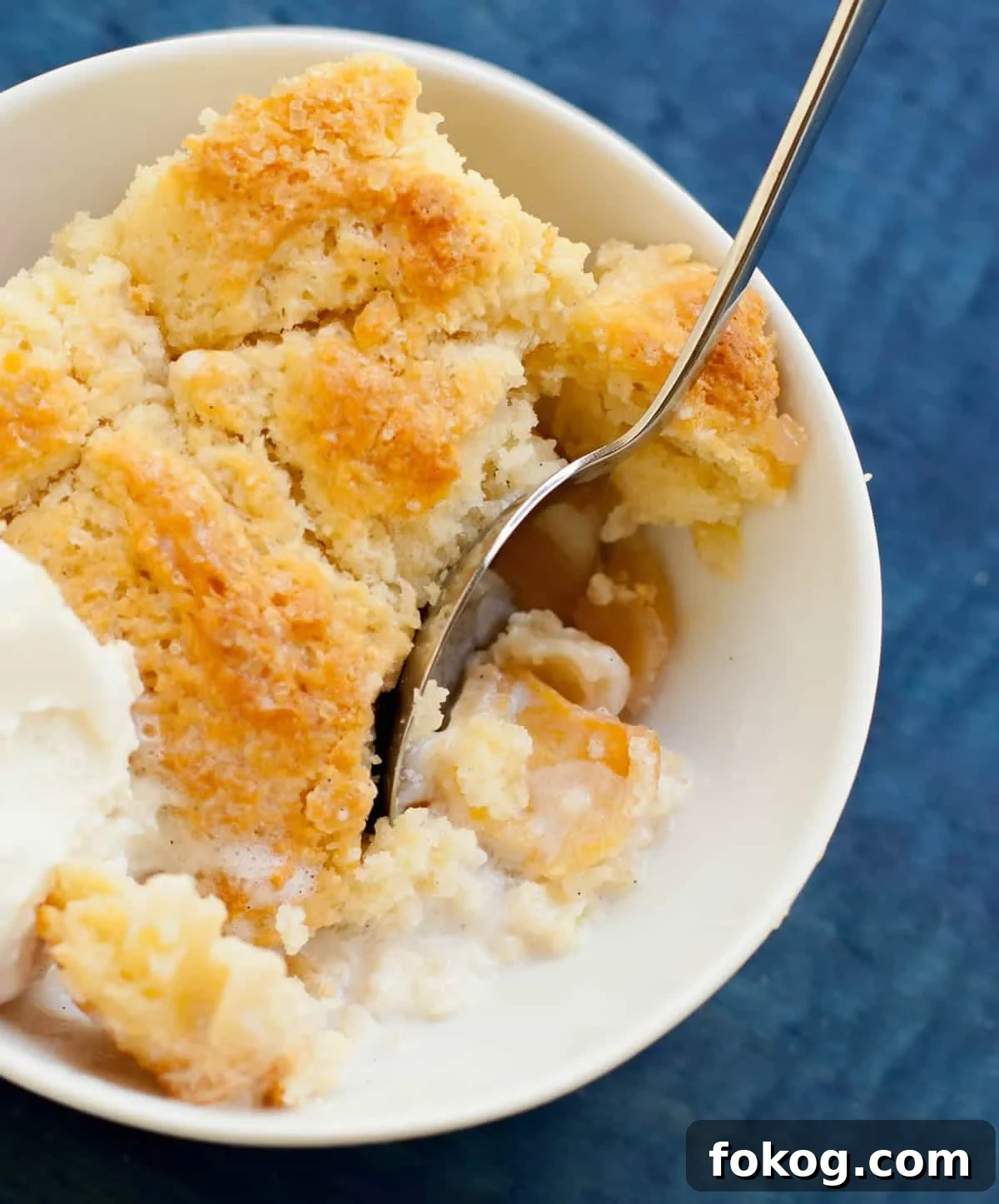 Georgia Peach Cobbler. Fresh peaches, lightly spiced and sweetened with two kinds of sugar, are baked under a delicious sweet biscuit topping!