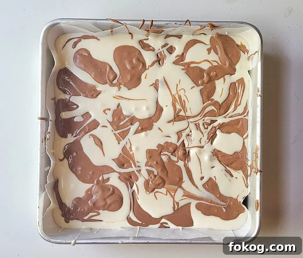 spooning in the cheesecake batter