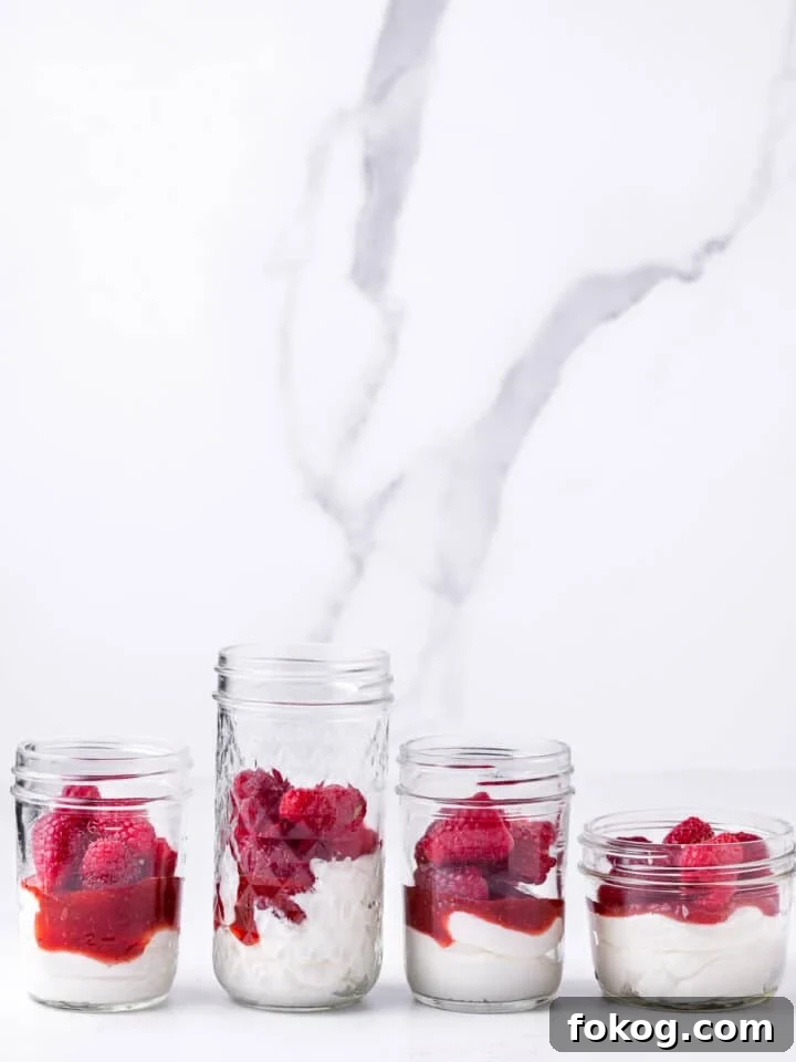 Creamy Raspberry Parfait Recipe with Crunchy Granola 6 fresh raspberries added to jars
