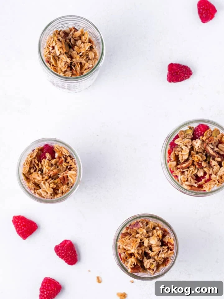 Creamy Raspberry Parfait Recipe with Crunchy Granola 8 overhead view of jars with granola and raspberries