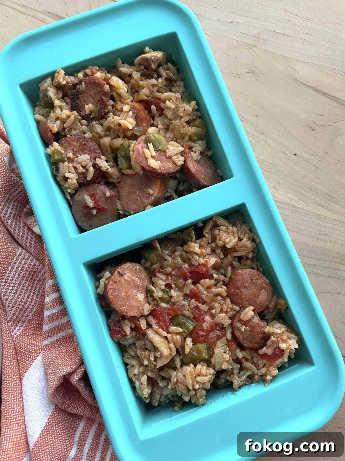 A two cup Souper cube container filled with leftover chicken and sausage jambalaya.