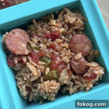 A filled two cup Souper cube container showing how to freeze jambalaya.