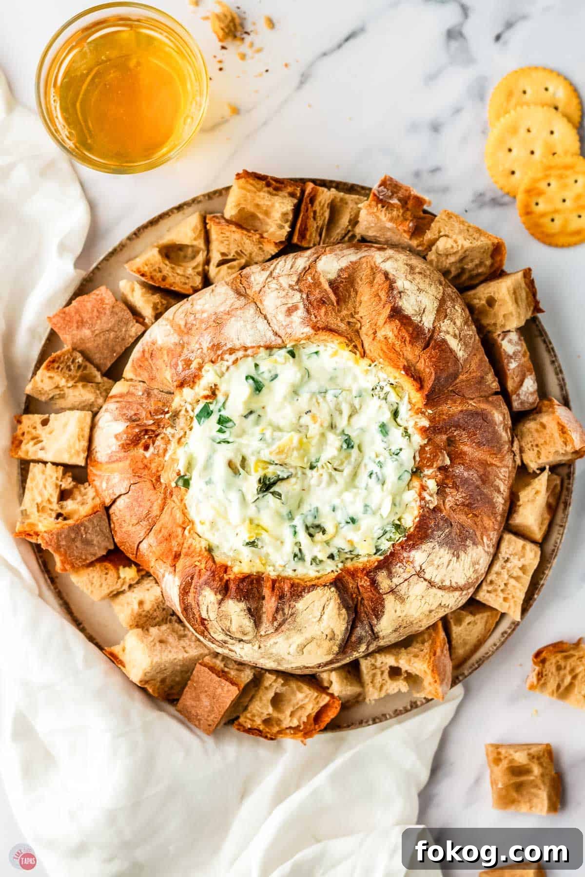 baked spinach dip in a bread bowl