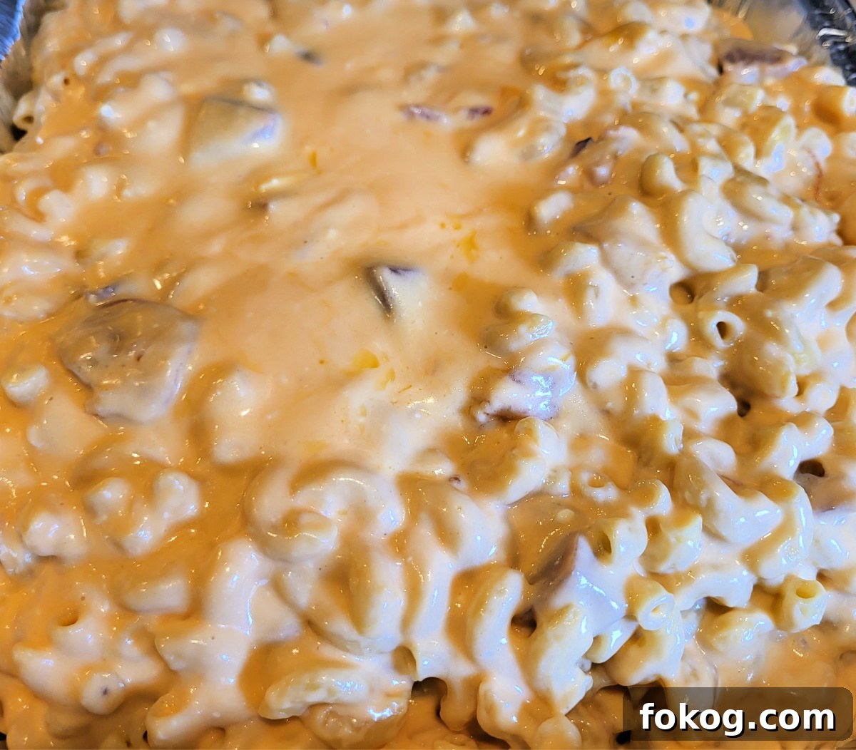 Creamy Smoked Ham Mac and Cheese 5 Smoked Ham Mac And Cheese in tin foil pan ready to smoke.