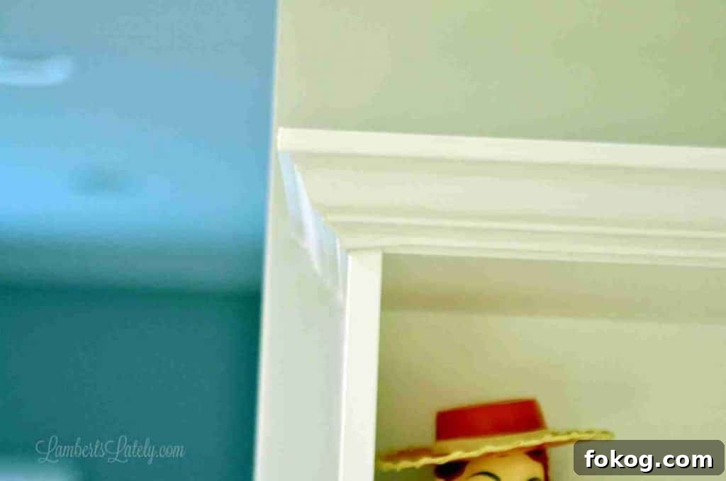 Built-In Bedroom Wardrobe Using IKEA Billy Bookcases 23 corner of crown molding on a shelf.
