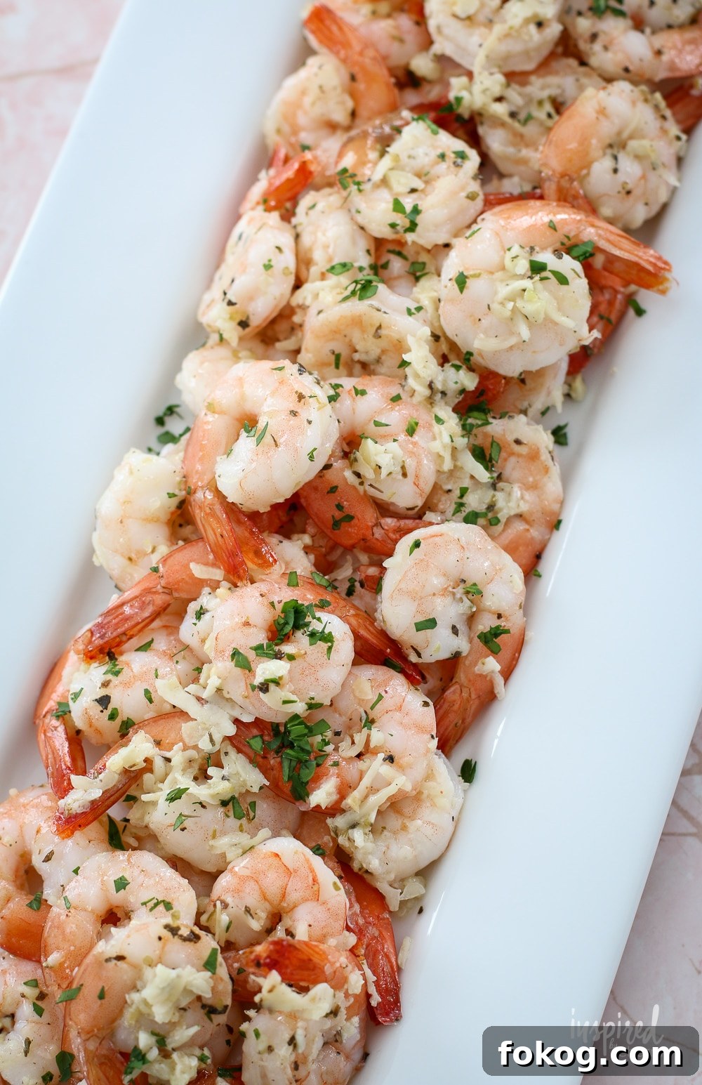 platter filled with parmesan garlic roasted shrimp.
