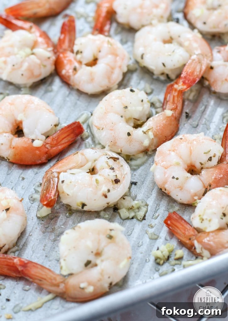 roasting pan filled with Roasted Parmesan Garlic Shrimp.