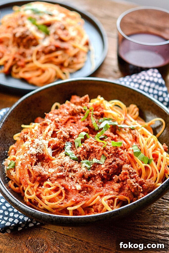 Slow Cooker Bolognese No need to stand over the stove while stirring all day long! Impress your family or dinner guests with this delicious Slow Cooker Bolognese that's so easy to make while still being so full of rich flavors.