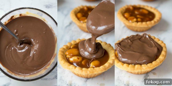 Mini Salted Caramel Snickers Tarts! Mini pre-baked tart shells with a salted caramel peanut filling and a chocolate peanut butter topping. Finish it off with chopped snickers and more peanuts, and you have the easiest/most decadent and delicious, bite-sized dessert!