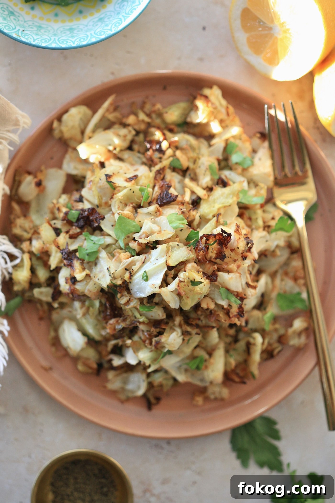 cabbage with green herbs on plate.