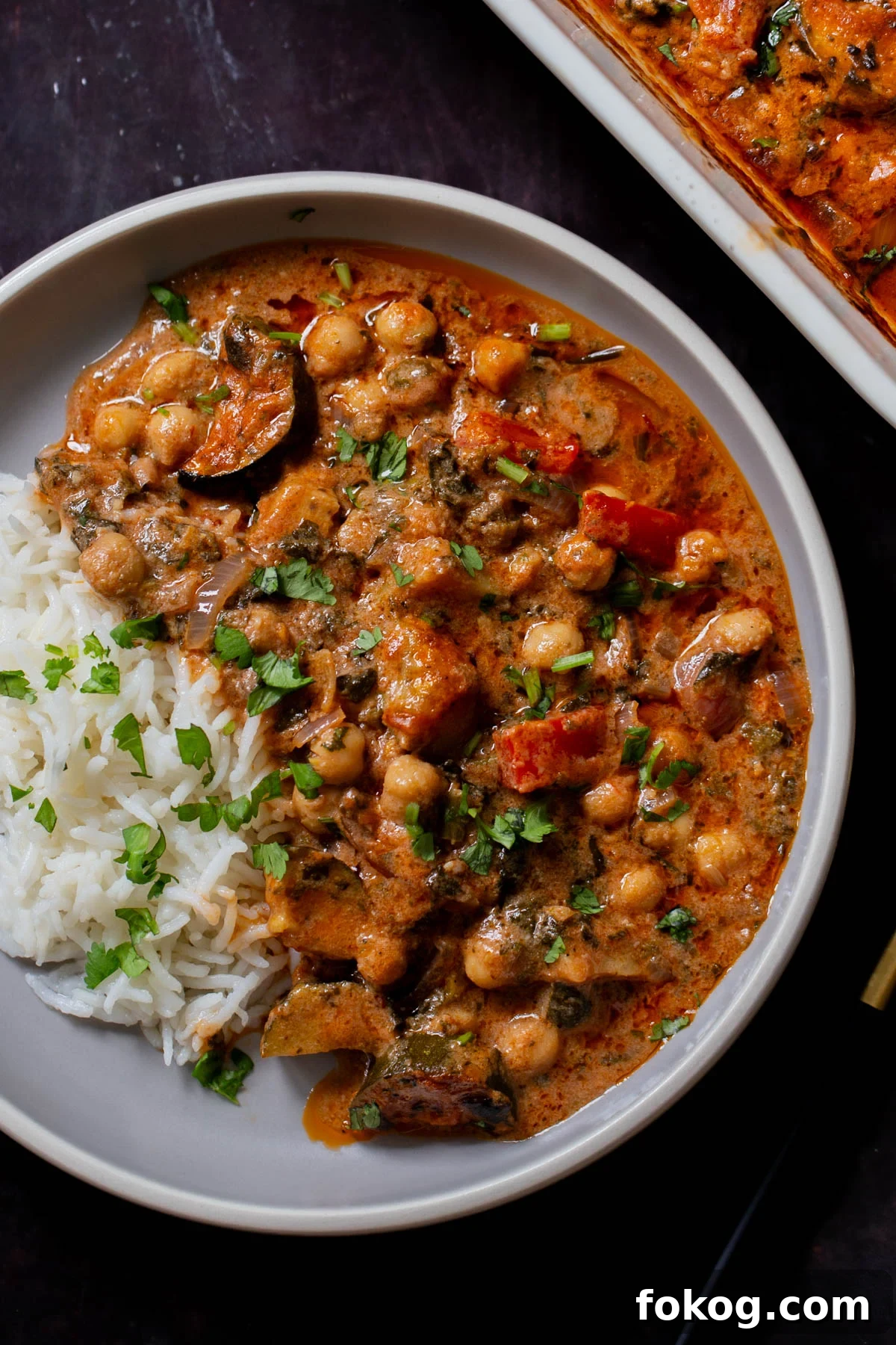 chickpea zucchini curry in a bowl with rice