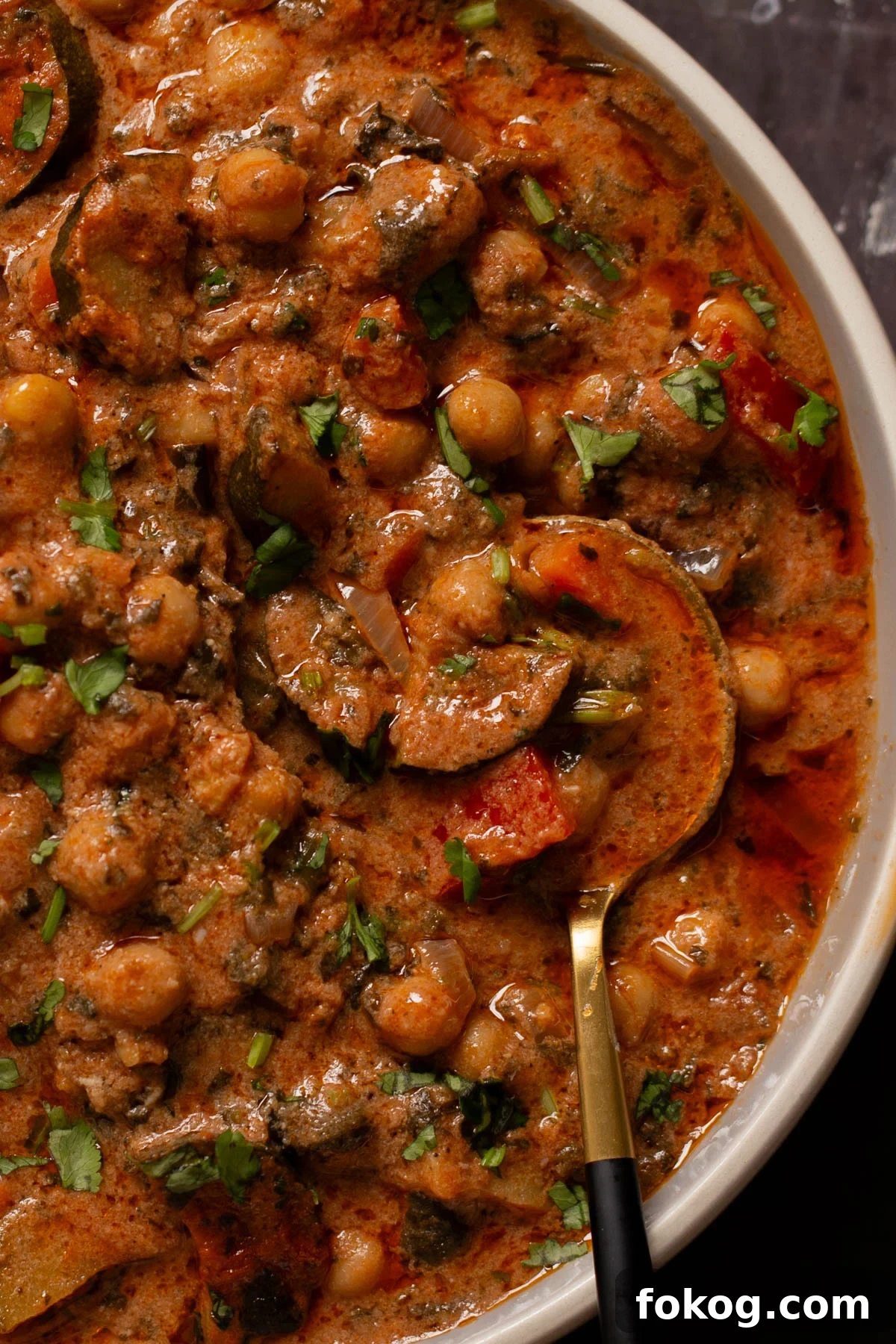 close-up of zucchini chickpea curry in a bowl