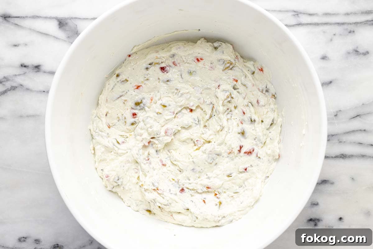 Creamy 10-Minute Olive Dip Recipe for Parties and Snacks 6 Bowl with freshly made olive dip in it.