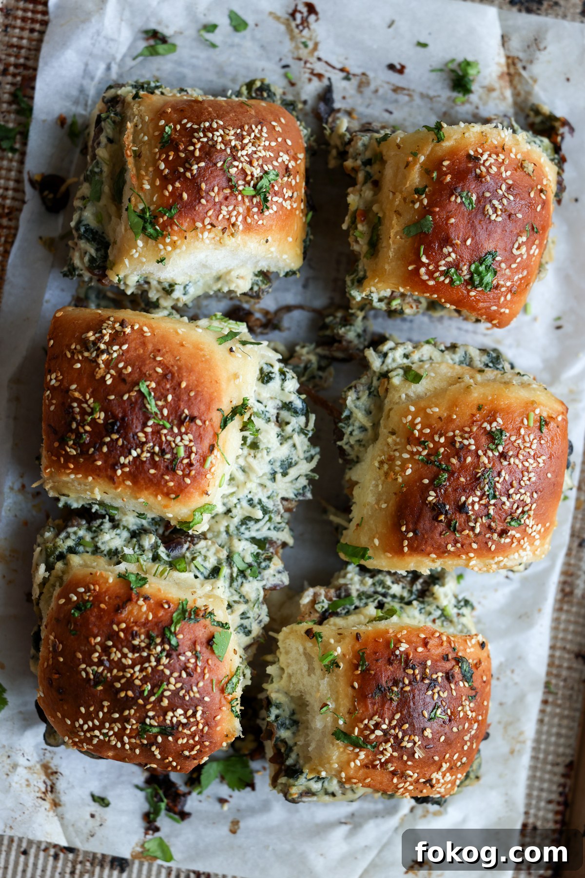 cheesy mushroom sliders on the baking sheet after baking