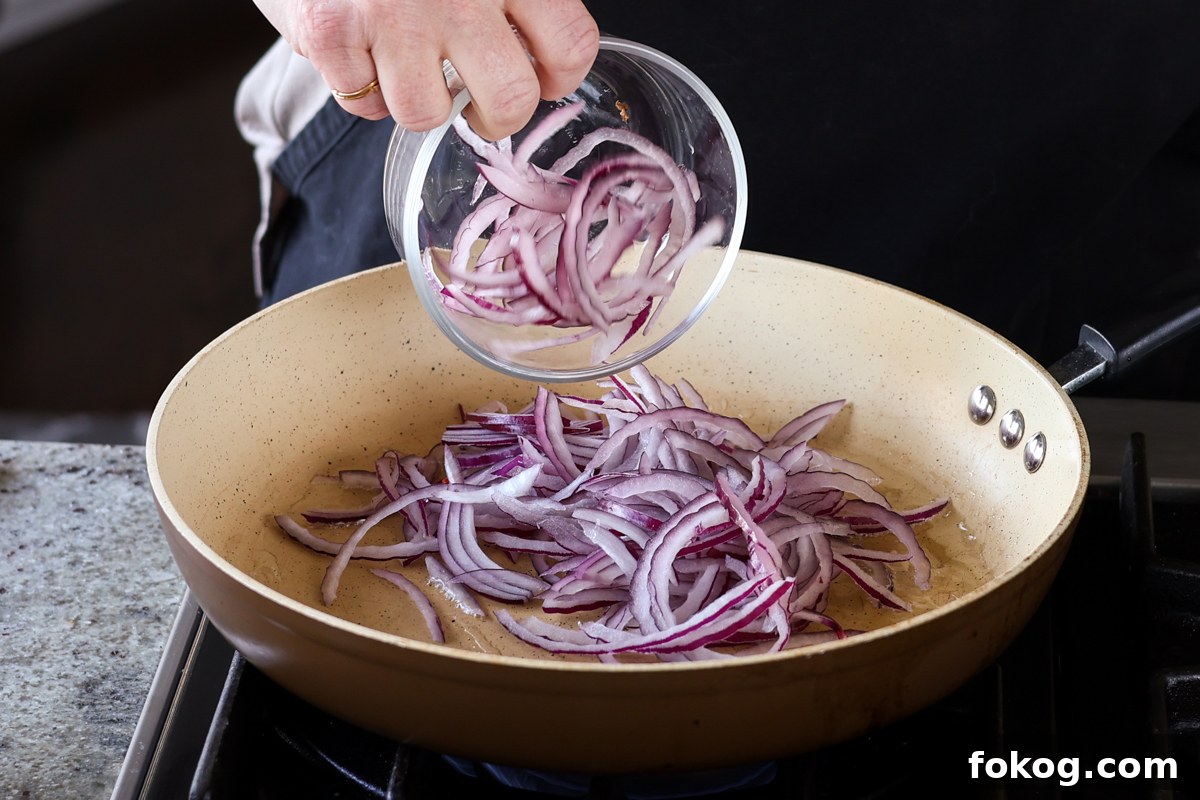 adding onion to the pan