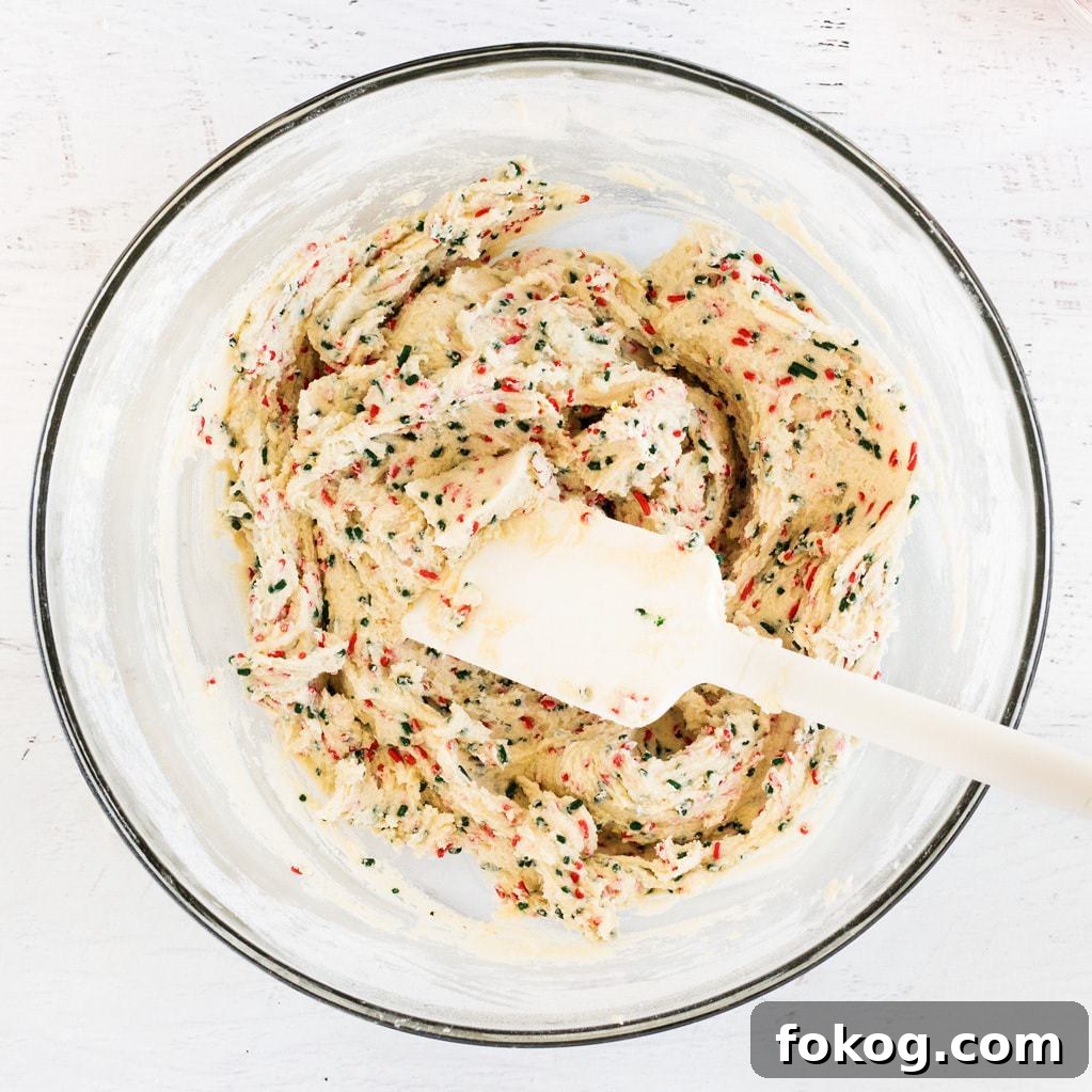 edible sugar cookie dough in glass bowl with spatula