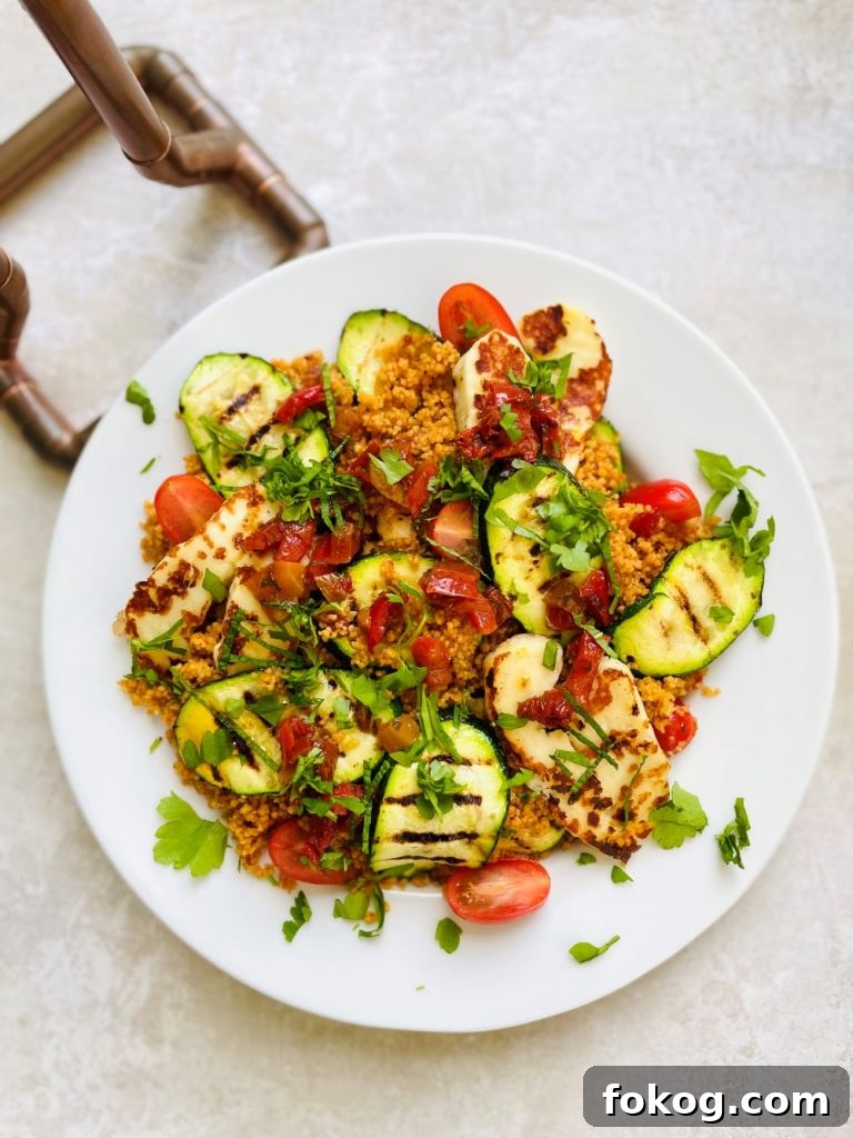 Light Summer Dinner Ideas: Quick Recipes for Warm Evenings 9 halloumi salad with couscous and courgettes on a white plate