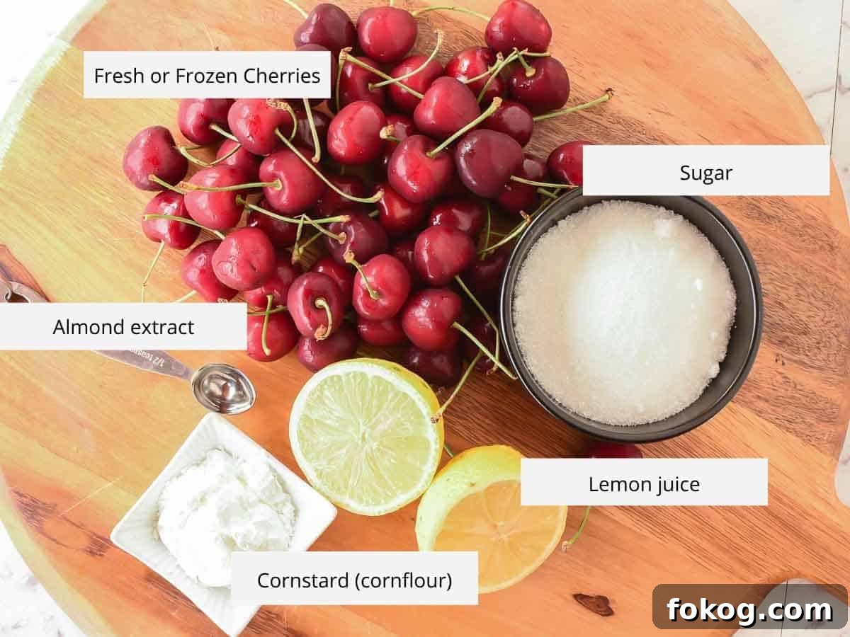 Cherry Sauce using only 5 ingredients is easy to make at home. Perfect to use for cakes, cheesecakes, ice cream, pancakes, waffles or any dessert. #cherrysauce #easy #recipe #fresh#frozen #icecream #cheesecake #sweet #best #cherry #fruitsauce #dessert Fresh cherries, sugar, cut lemon, metal spoon and cornstarch on wooden board viewed from above.