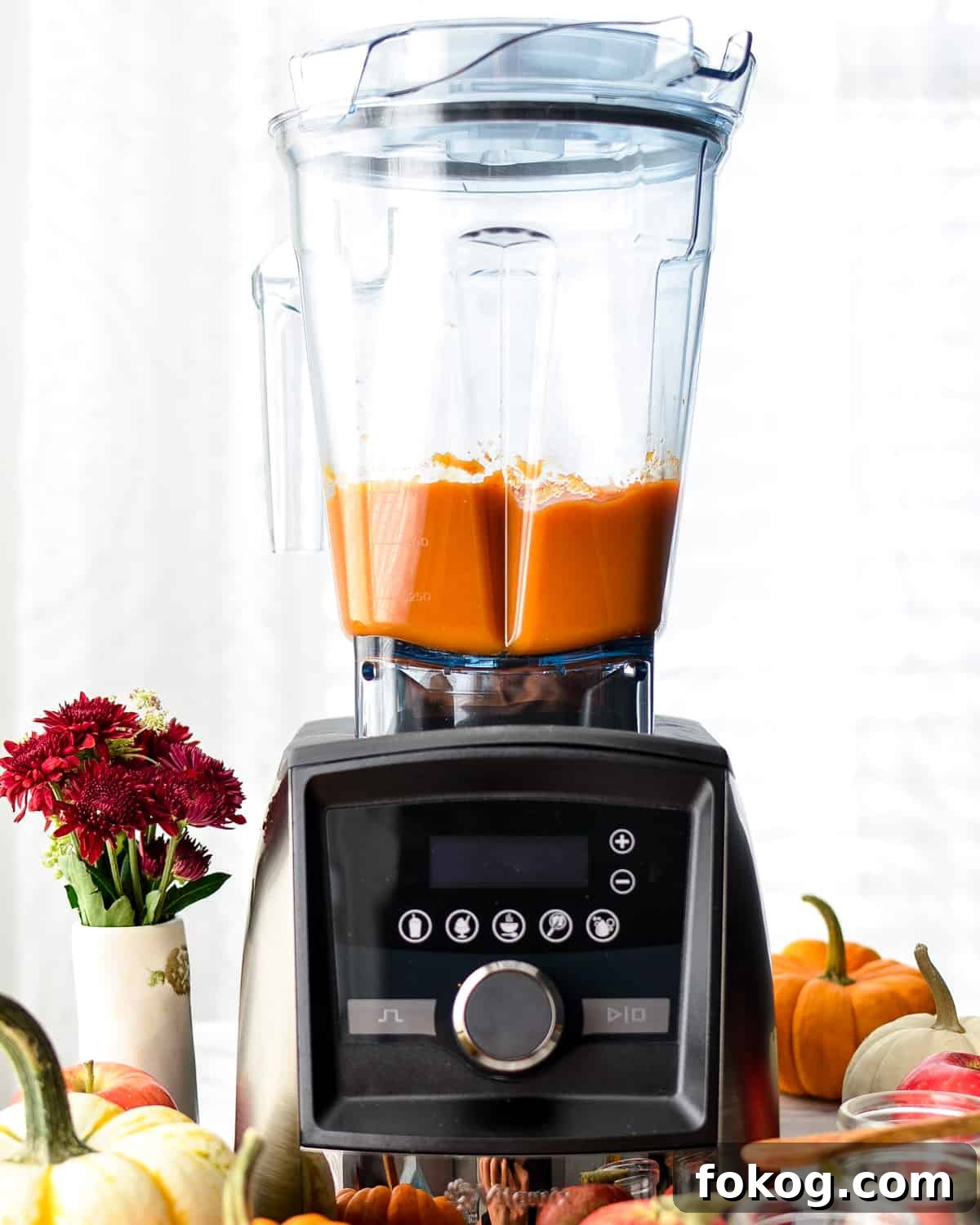 Front view of a vitamix blender with Homemade Apple & Pumpkin Baby Food puree inside