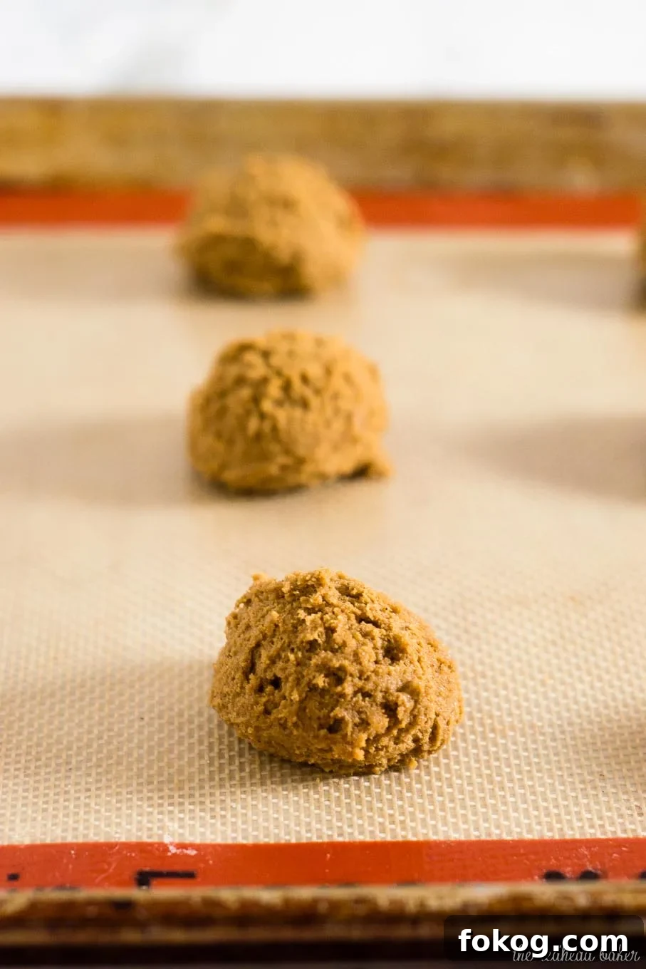 Warmly spiced gingerbread cookies get fancy for the holidays with a dip in white chocolate. Santa will love getting these cookies on Christmas Eve! 
