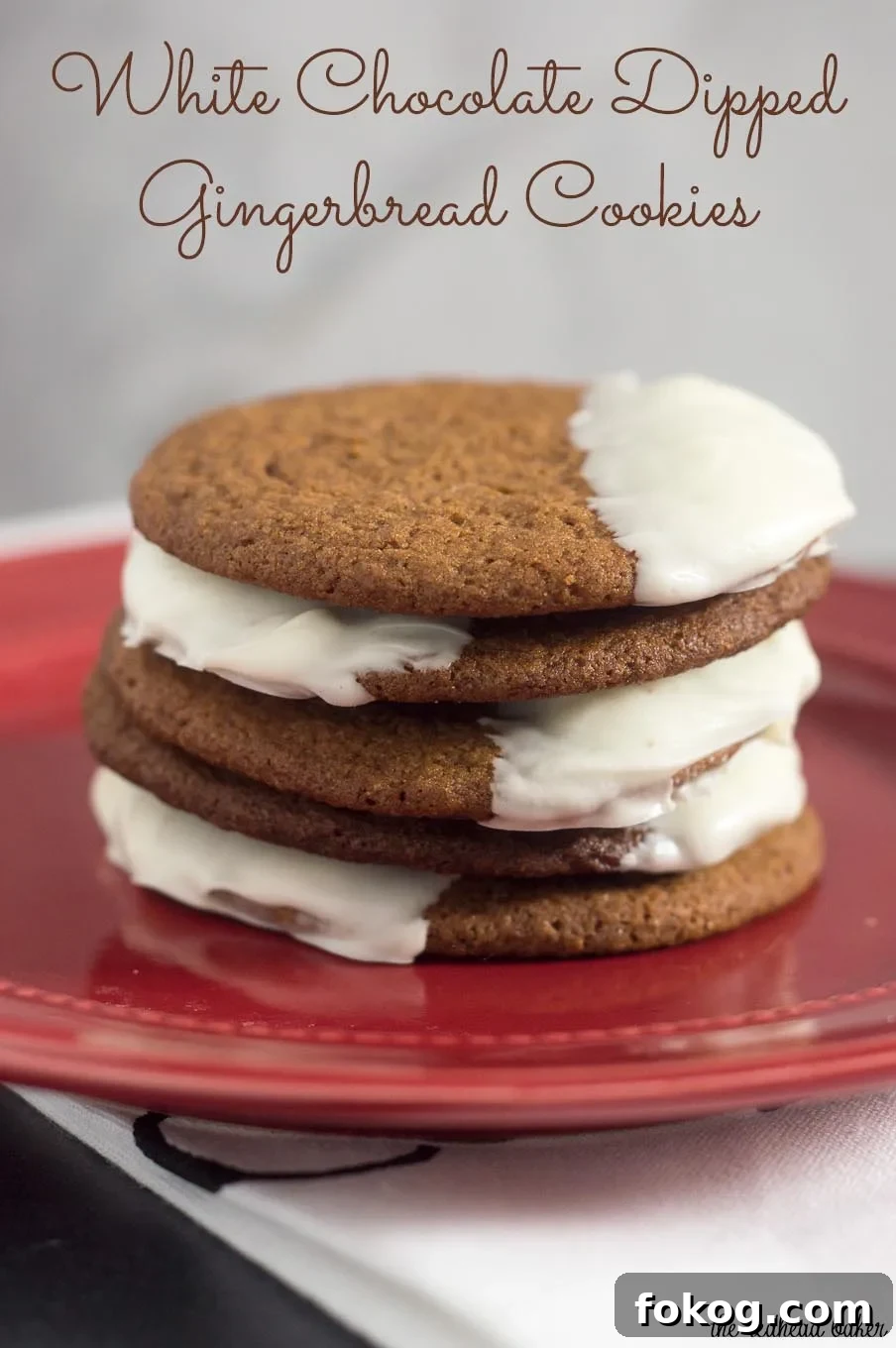Warmly spiced gingerbread cookies get fancy for the holidays with a dip in white chocolate. Santa will love getting these cookies on Christmas Eve! 