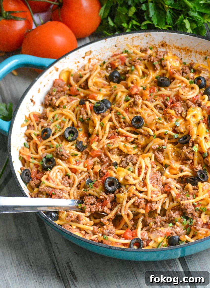 taco spaghetti in a large blue skillet