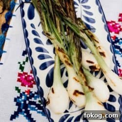 Grilled Spring Onions with Garlic Lime Butter 7 cebollitas asadas on a rectangular plate