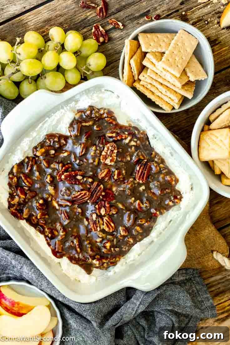 easy pecan pie dip with crackers and fruits on the table