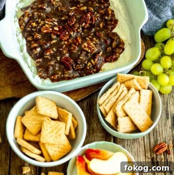 pecan pie dip with crackers, biscuits, and apples in a bowl